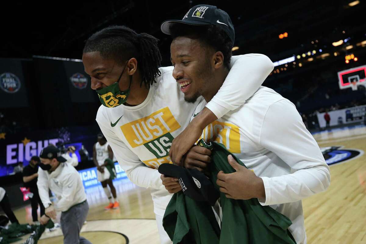 INDIANAPOLIS, INDIANA - MARCH 29: L.J. Cryer #4 of the Baylor Bears and Jordan Turner #5 celebrate after defeating the Arkansas Razorbacks in the Elite Eight round of the 2021 NCAA Men's Basketball Tournament at Lucas Oil Stadium on March 29, 2021 in Indianapolis, Indiana. (Photo by Jamie Squire/Getty Images)