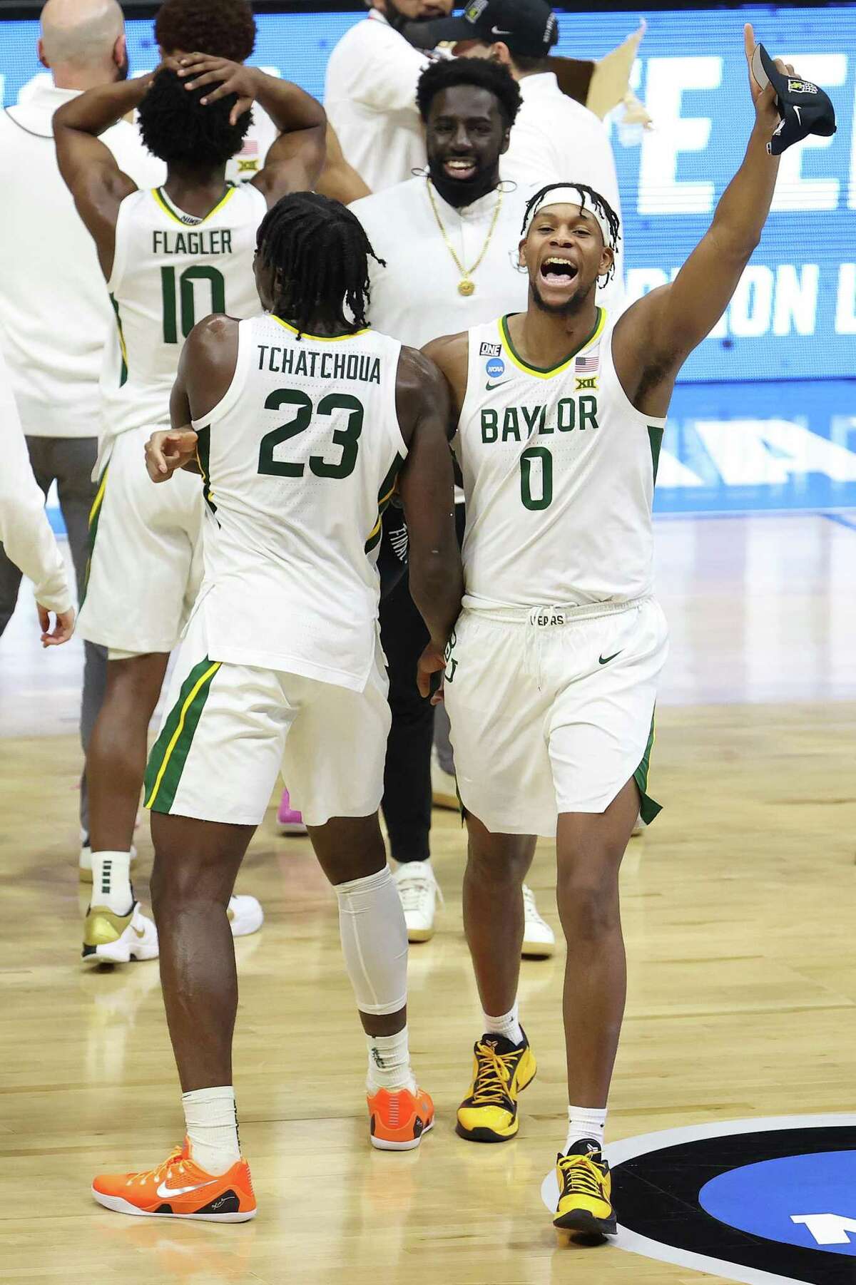 INDIANAPOLIS, INDIANA - MARCH 29: Flo Thamba #0 of the Baylor Bears and Jonathan Tchamwa Tchatchoua #23 celebrate after defeating the Arkansas Razorbacks in the Elite Eight round of the 2021 NCAA Men's Basketball Tournament at Lucas Oil Stadium on March 29, 2021 in Indianapolis, Indiana. (Photo by Andy Lyons/Getty Images)