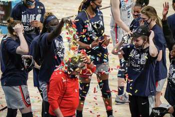 UConn coach Geno Auriemma is dunked with confetti after defeating Baylor in the Elite Eight round of the NCAA tournament on Monday.