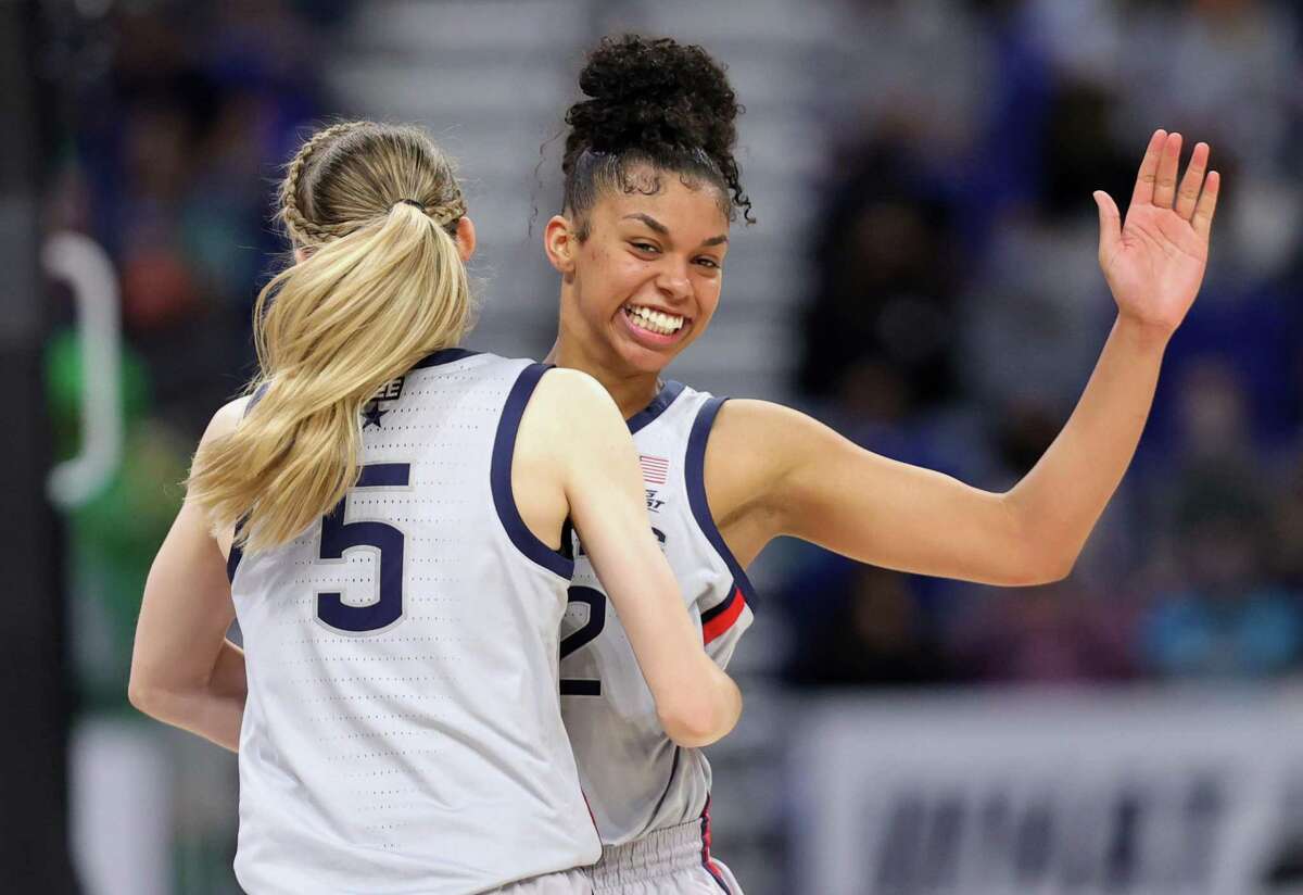 Evina Westbrook #22 celebrates with Paige Bueckers #5 of the UConn Huskies late in the second half against the Baylor Lady Bears in the Elite Eight round of the NCAA Women's Basketball Tournament at the Alamodome on March 29, 2021 in San Antonio, Texas.  19-0 run Between the injury and the end of the third quarter, UConn would go on an 8-0 run, propelled by 3-pointers from Bueckers and Christyn Williams and a key steal also from Bueckers. That 8-0 run would balloon to a 19-0 run by the time the first three minutes of the fourth quarter were over. A steal by Westbrook and a foul shortly thereafter led to two free throws by Williams. Edwards followed with a layup, a jumper by Bueckers, a 3-pointer from Bueckers and another jumped from Williams led to a 9-point lead. “Well, we put ourselves in that situation,” Auriemma said of the deficit. “We made it incredibly difficult on ourselves. I thought DiDi Richards getting hurt, I think, probably opened up some things for us defensively - on offense, and we were able to take advantage of that. But late in the game, with a couple of violations, a couple of missed free throws and - but we made enough plays.”