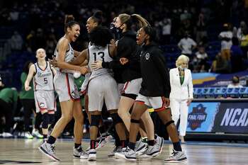 UConn celebrates the win over Baylor after the Elite Eight round of the Women's NCAA Tournament at the Alamodome on Monday in San Antonio, Texas.The UConn Huskies defeated the Baylor Lady Bears 69-67 to advance to the Final Four.