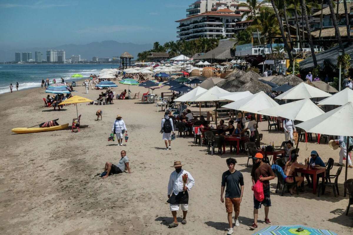 A busy beach in Puerto Vallarta, Jalisco state, Mexico, on March 6, 2021.
