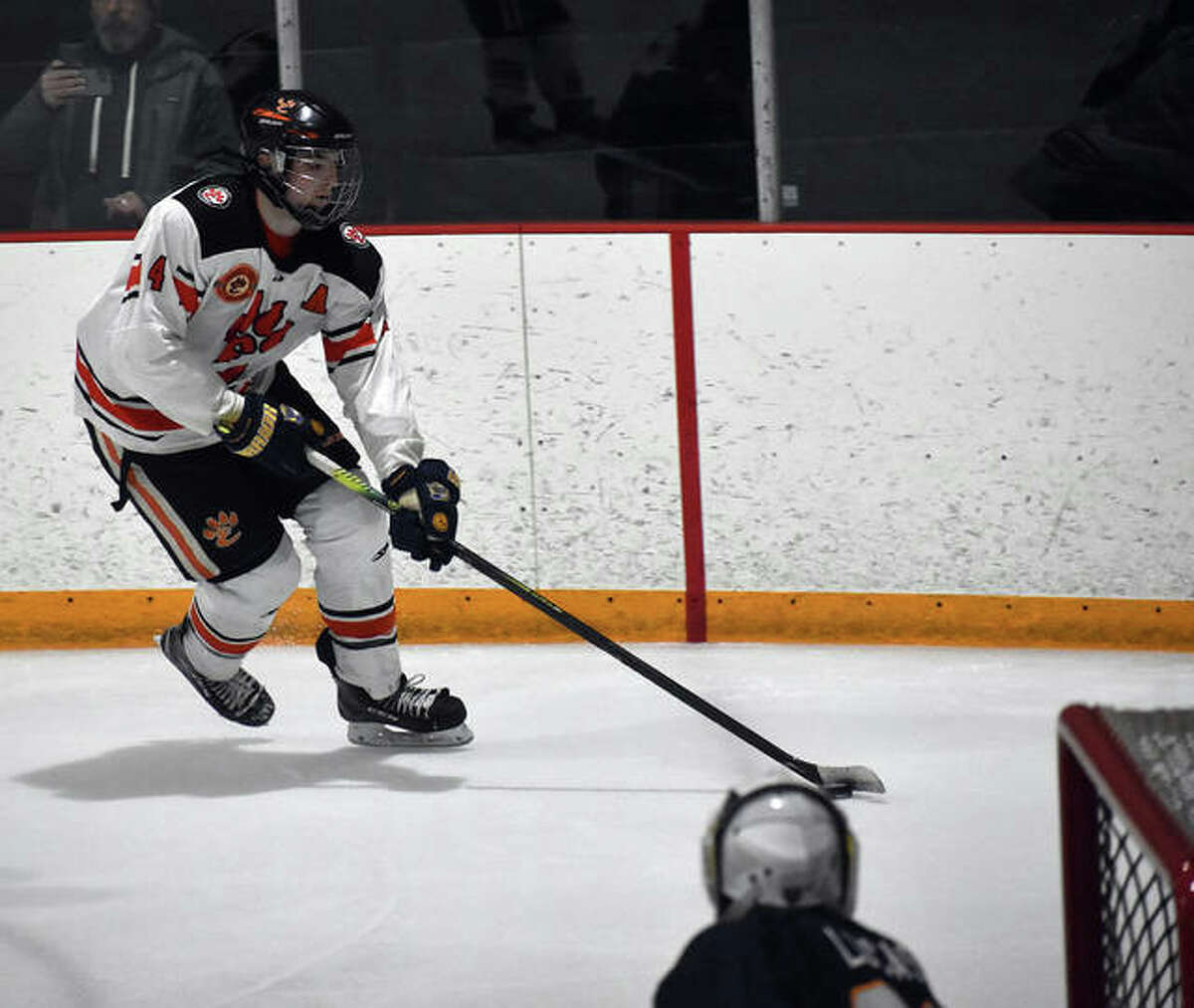 Edwardsville’s Parker Terch skates towards the goal after collecting the puck near the boards in the second period against O’Fallon inside the East Alton Ice Arena.