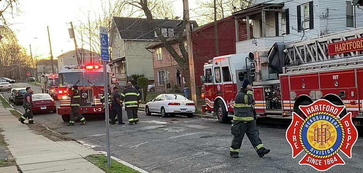 Crews operating at a house fire on Loomis Street in Hartford, Conn., on Monday, March 30, 2021.