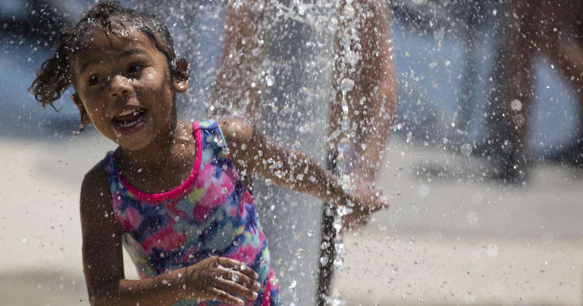 Aaliyah Spann, 4, runs through water spurting from the ground at Pearsall Park, Tuesday, August 13, 2019, in San Antonio. 