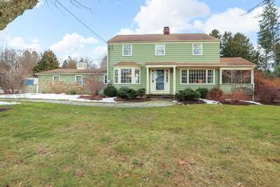 Sage green-colored colonial house with ivory trim at 26 Flat Rock Road, Easton.