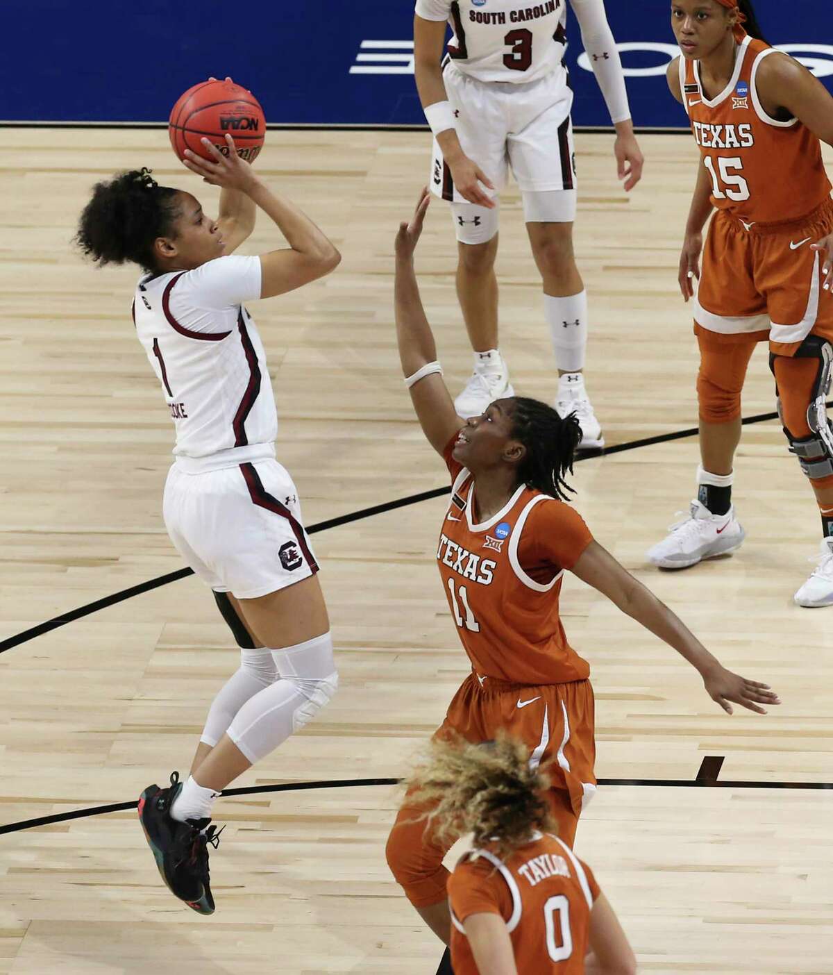 South Carolina’s Zia Cooke (01) scores over Texas’ Joanne Allen-Taylor (11) during their Elite Eight regional championship game of the 2021 NCAA Women’s Basketball tournament at the Alamodome on Tuesday, Mar. 30, 2021.