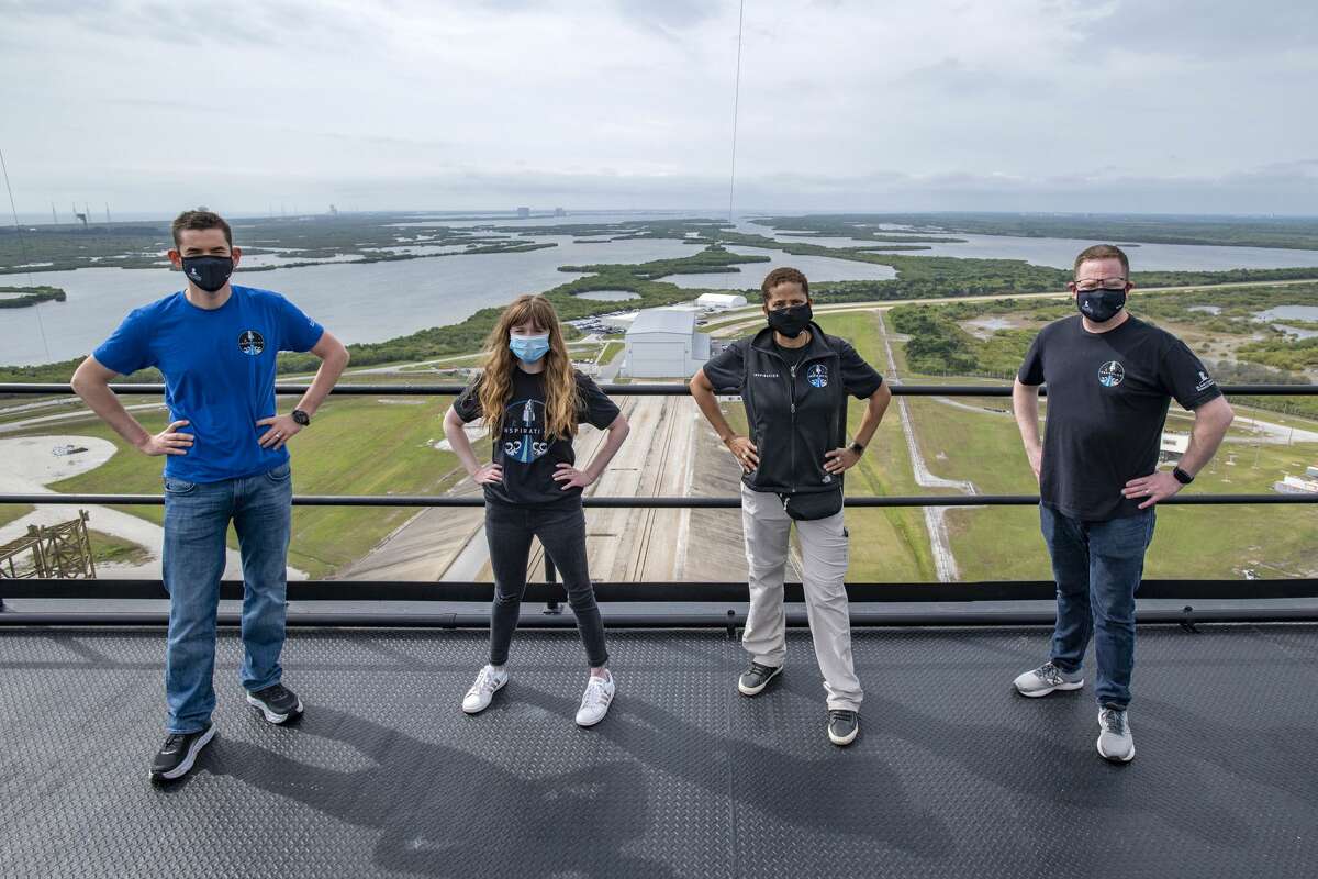 Inspiration4 mission crew members (from left) Jared Isaacman, Hayley Arceneaux, Sian Proctor and Chris Sembroski pose at SpaceX Launch Tower at Kennedy Space Center.