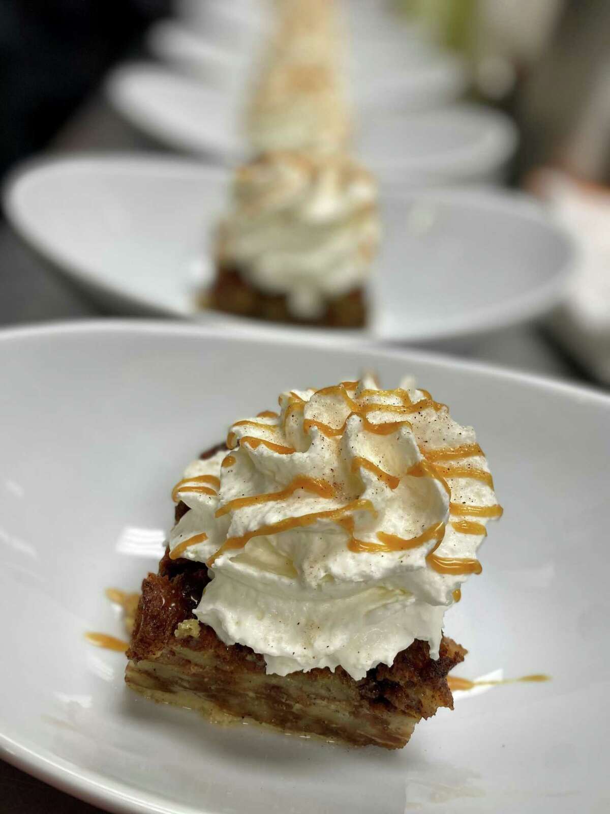 Churro bread pudding with horchata whipped cream is one of the dessert dishes at Stix & Stone.