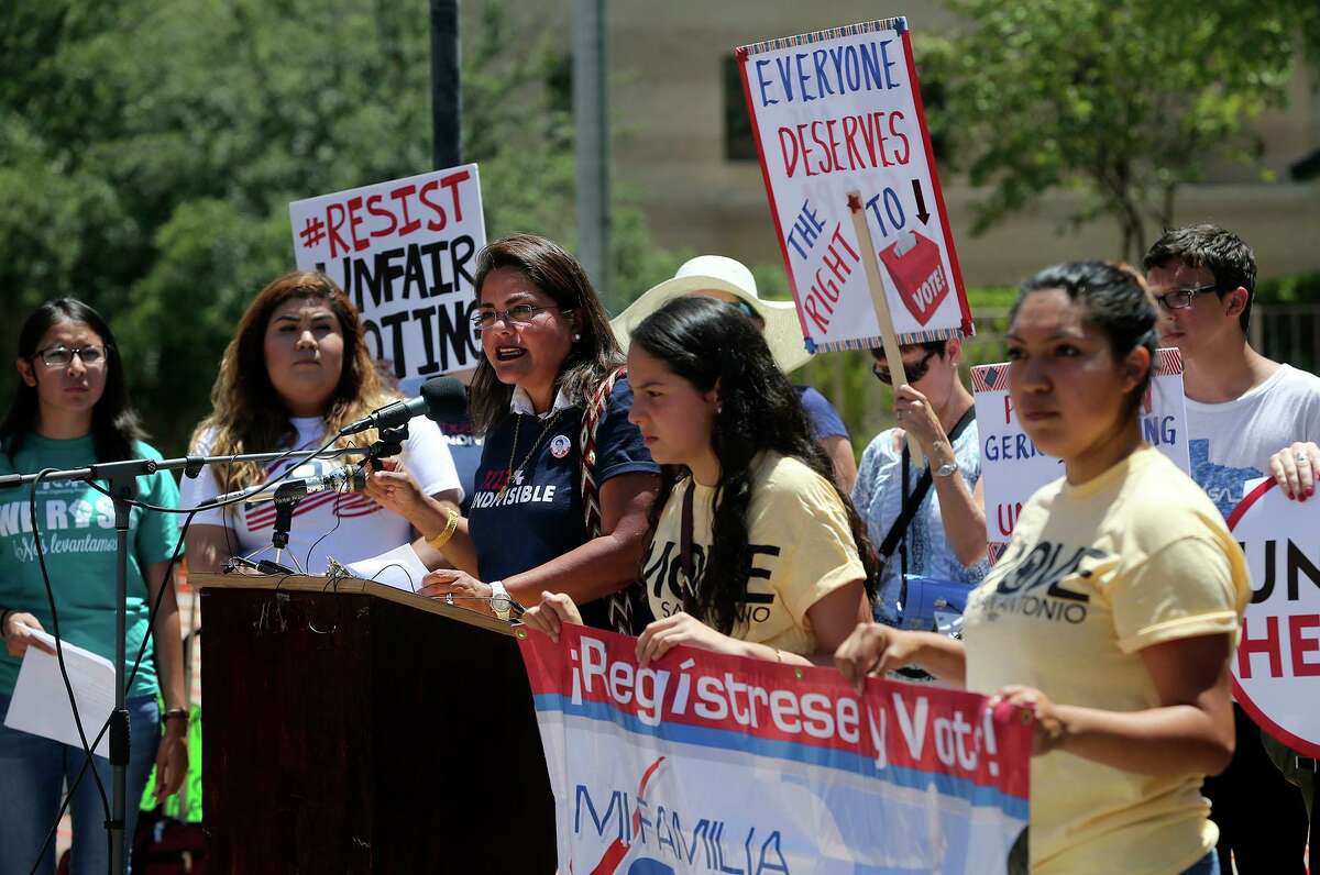 In this 2017 photo, protesters speak out against the suppression of minority voters. Texas is back at it with another round of redistricting. A reader has a suggestion, which lawmakers will ignore.