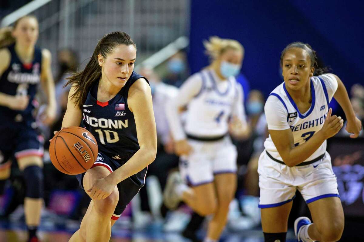 UConn guard Nika Muhl dribbles the ball against Creighton guard DeArica Pryor during a game in February.