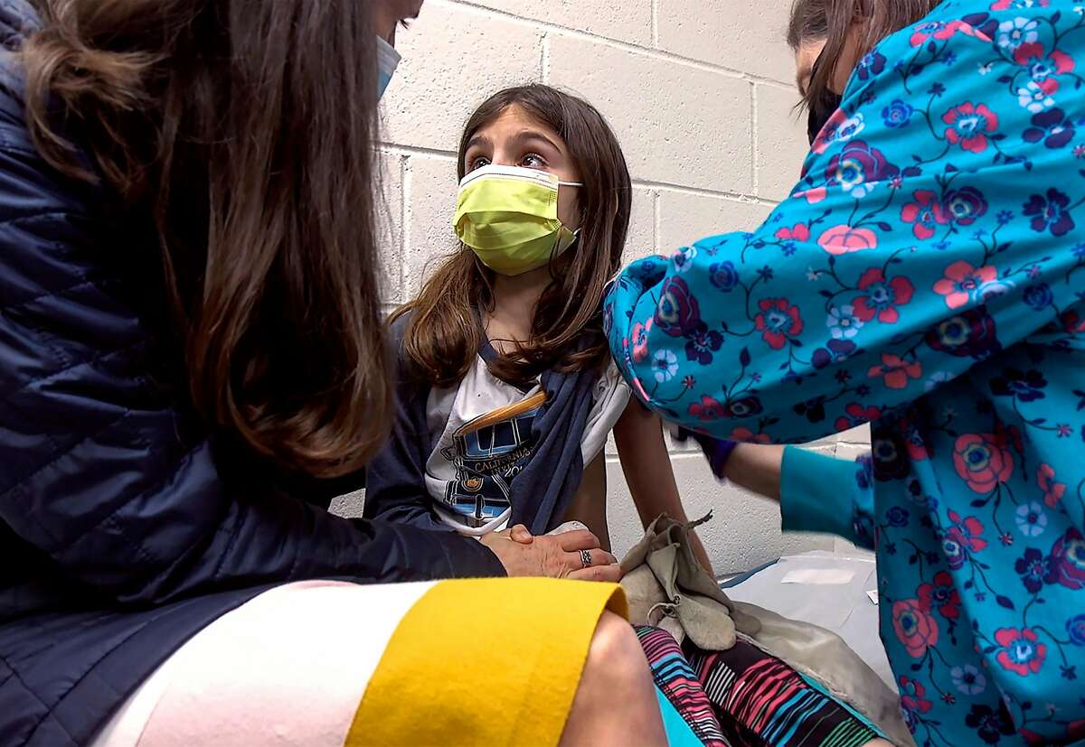 Alejandra Gerardo, 9, gets the first of two Pfizer vaccinations in March during a clinical trial for children in Durham, N.C.
