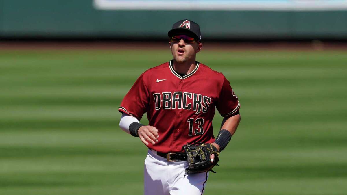 Diamondbacks shortstop Nick Ahmed (13) runs to the dugout during a spring training game in Scottsdale, Ariz. earlier this month.