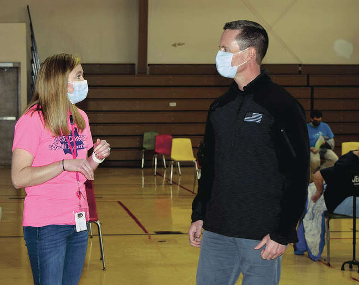 U.S. Rep. Rodney Davis talks to registered nurse Heidi Carter during a visit to a vaccination site in Jerseyville.