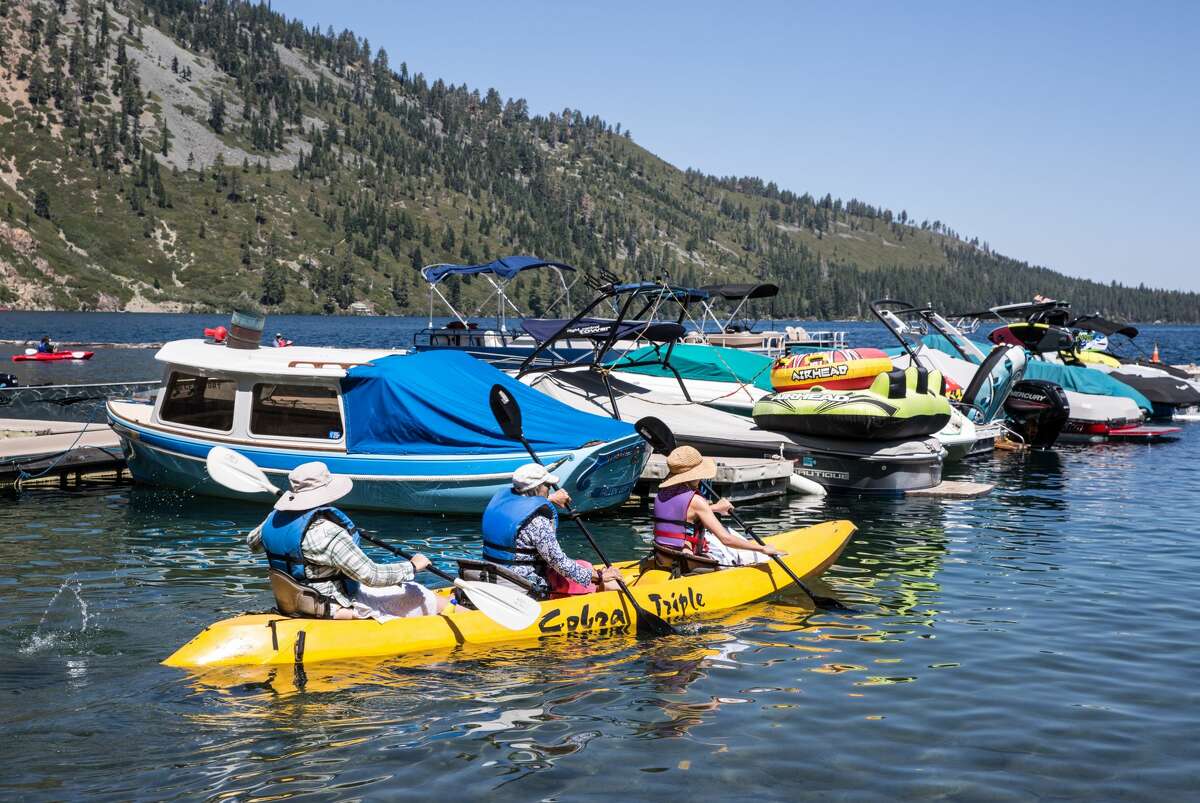 Kayakers enjoy a sunny day at Fallen Leaf Lake, located adjacent to Lake Tahoe near Emerald Bay, in South Lake Tahoe, Calif.