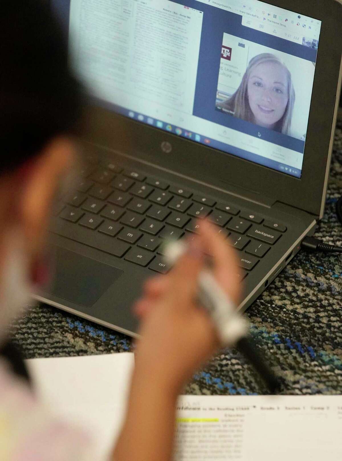 Jennifer Rosa, 8, participates in a virtual session with Texas A&M senior Grace Neal during their class at Grand Oaks Elementary School, 20241 Cypress Rosehill Rd., Thursday, March 25, 2021 in Tomball. Neal is one of dozens of seniors in Texas A&M's College of Education who have been streamed into Tomball ISD's classrooms this year. Teachers set up a laptop so the soon-to-be educators can work with students in small groups or one on one.