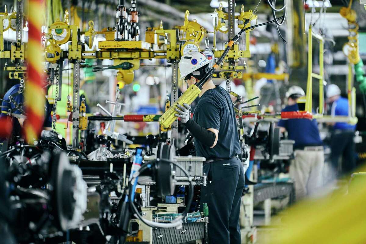 Employees work on the assembly line at Toyota’s manufacturing plant in San Antonio.