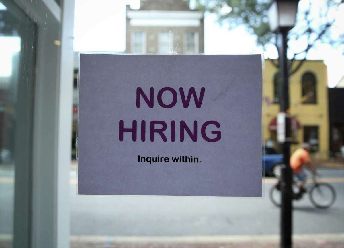 ALEXANDRIA, VA - JULY 05: A hiring sign is seen July 5, 2013 in Old Town Alexandria, Virginia. The Labor Department reported that U.S. economy has added 195,000 jobs in June with the unemployment rate remained unchanged at 7.6 percent. (Photo by Alex Wong/Getty Images)