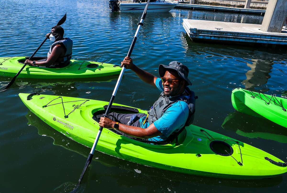 Julius Crowe Hampton, a Outdoor Afro leader, kayaks at Marina Bay Yacht Harbor in Richmond.