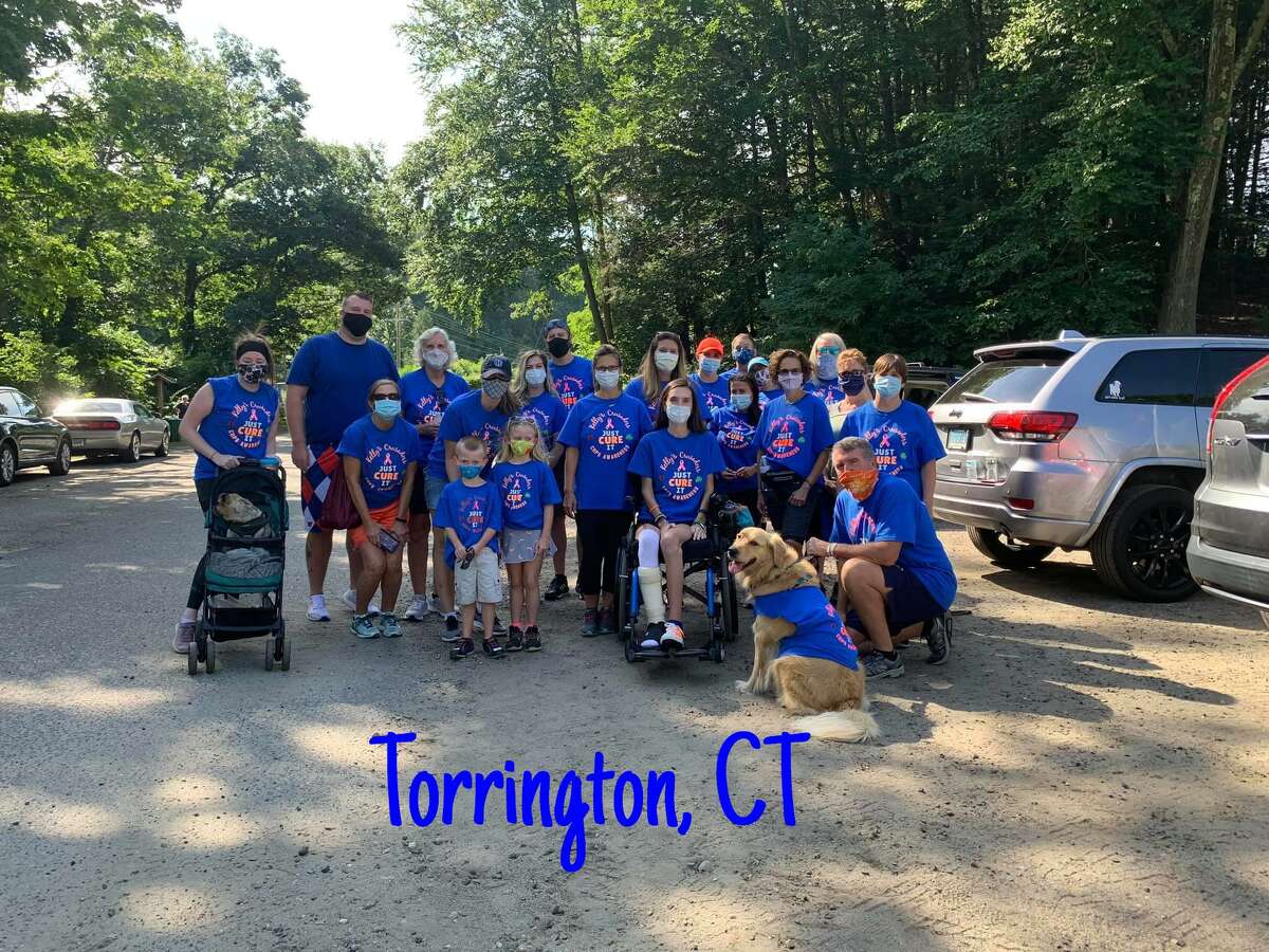 Kelly Considine of Torrington, seated, with members of her team, Kelly’s Crusaders, held a fundraising walk for CRPS on the Sue Grossman Still River Greenway in Torrington in 2020.