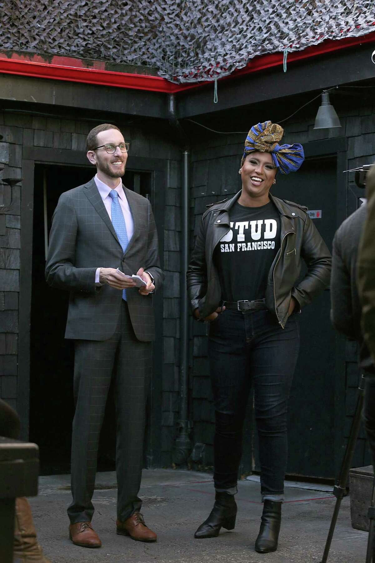 State Sen. Scott Wiener (left) talks with Honey Mahogany in 2017 after announcing a bill that would allow bars to stay open until 4 a.m. is being reintroduced at San Francisco Eagle bar.