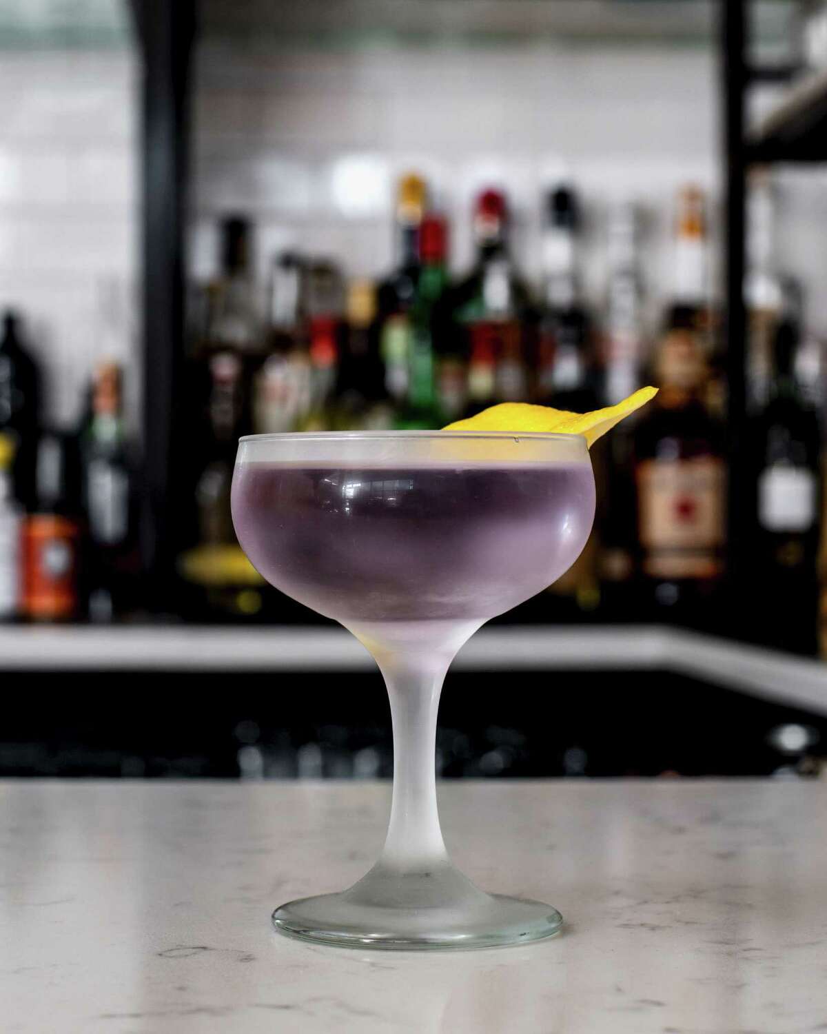 Cocktails at L’Ostal ($14) feature gin, creme de violette, mezcal, rye, amaro, cognac and dry curacao.