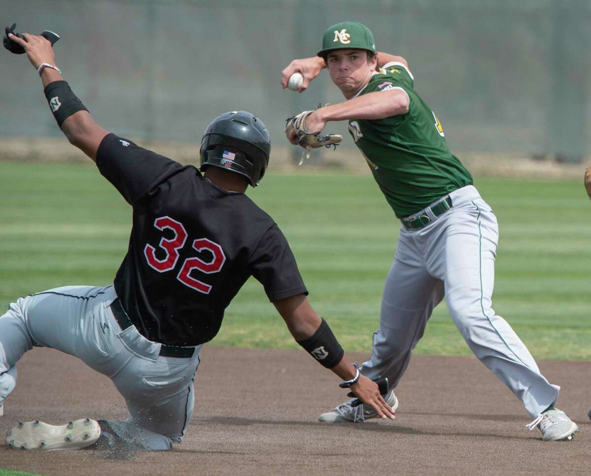 Midland College's Tyler Wulfert makes the tag at second on NMMI's Gavon Clemons and makes the throw to first for a double play 04/02/21 at Christensen Stadium. Tim Fischer/Reporter-Telegram