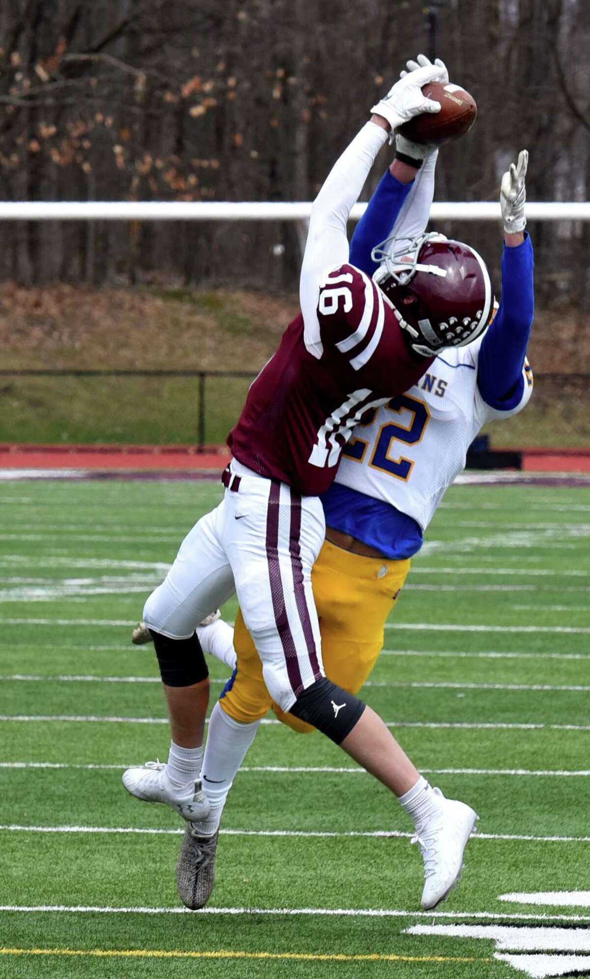 Queensbury's Patrick Morehouse, right, breaks up a pass intended for Burnt Hills-Ballston Lake's Vincent Venditti, left, during a varsity football game on Friday, April 2, 2021, at Burnt Hills-Ballston Lake High School in Ballston, N.Y. (Will Waldron/Times Union)