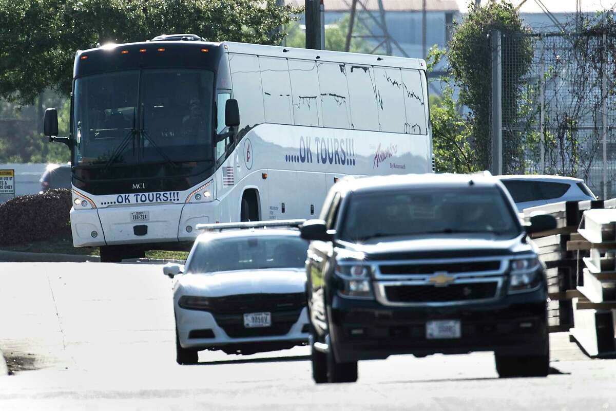 A bus carrying a group of migrant teenagers arrives to the grounds of the National Association of Christian Churches warehouse, on Friday, April 2, 2021, in Houston. A total of five hundred unaccompanied migrant teenage girls are expected to be housed at this facility.