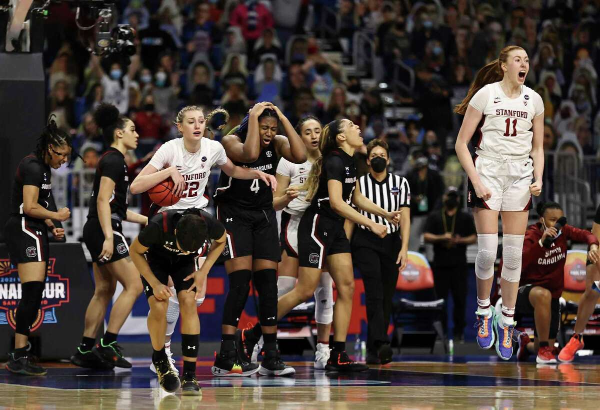 SAN ANTONIO, TEXAS - APRIL 02: The Stanford Cardinal celebrate after defeating the South Carolina Gamecocks in the Final Four semifinal game of the 2021 NCAA Women's Basketball Tournament at the Alamodome on April 02, 2021 in San Antonio, Texas. (Photo by Elsa/Getty Images)