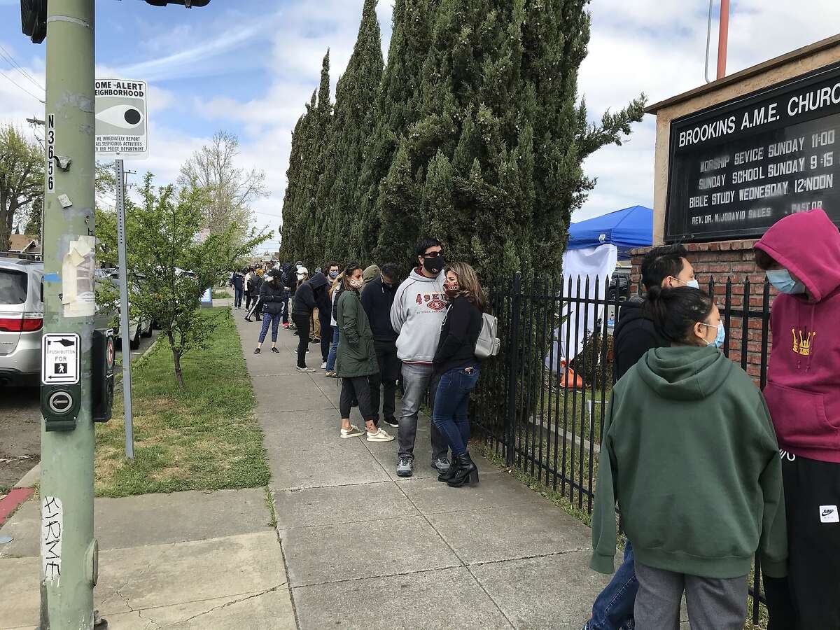 Hundreds of people show up for COVID vaccinations during a four-day pop-up clinic at Brookins AME Church in East Oakland.