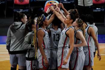 UConn women's basketball team huddles before facing Arizona in the Final Four on Friday in San Antonio.