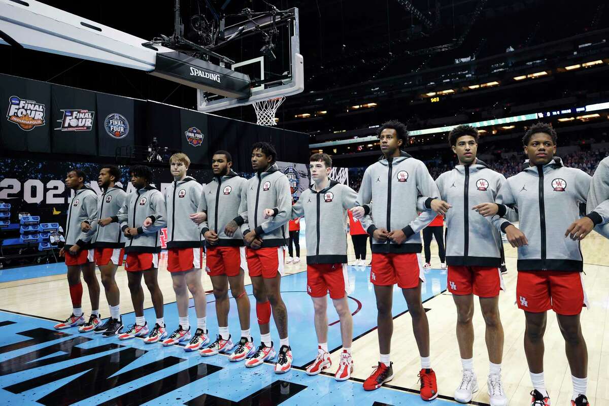 INDIANAPOLIS, INDIANA - APRIL 03: The Houston Cougars stand on the court during the national anthem before the 2021 NCAA Final Four semifinal against the Baylor Bears at Lucas Oil Stadium on April 03, 2021 in Indianapolis, Indiana.