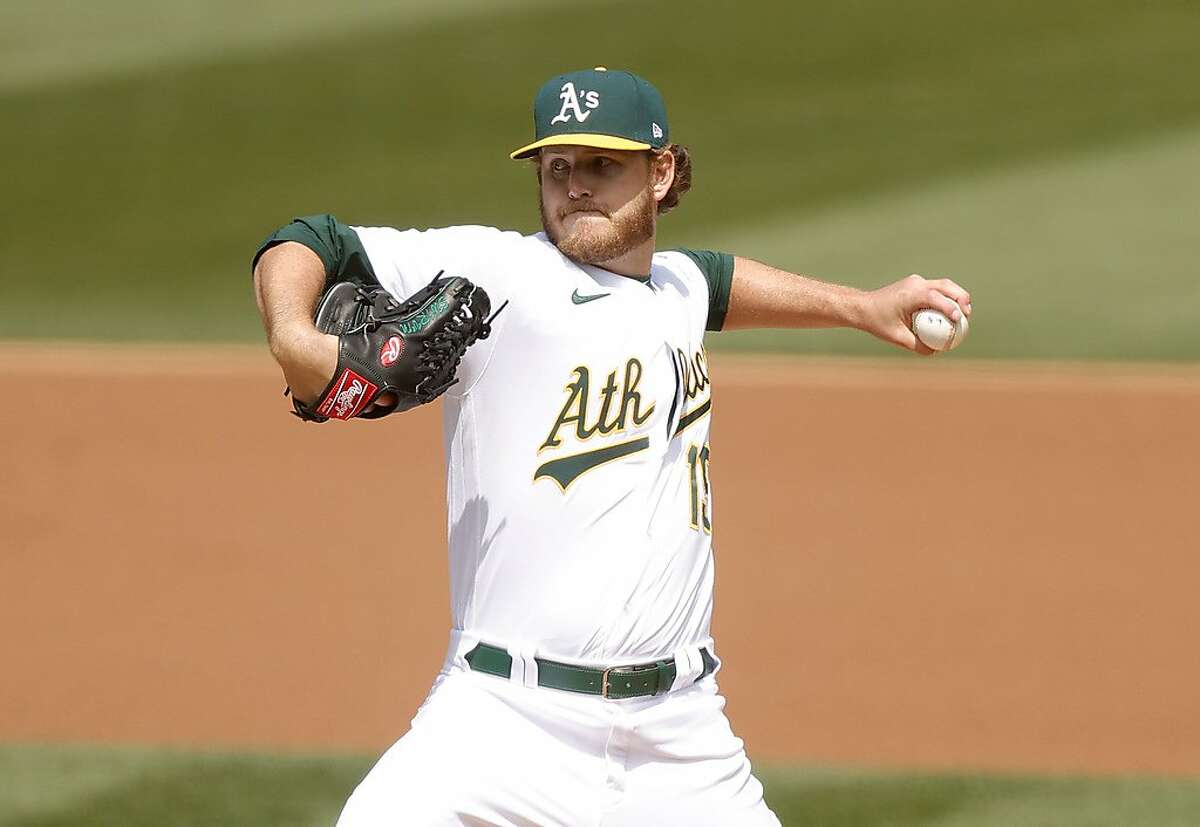 OAKLAND, CALIFORNIA - APRIL 03: Cole Irvin #19 of the Oakland Athletics pitches against the Houston Astros in the first inning at RingCentral Coliseum on April 03, 2021 in Oakland, California. (Photo by Ezra Shaw/Getty Images)