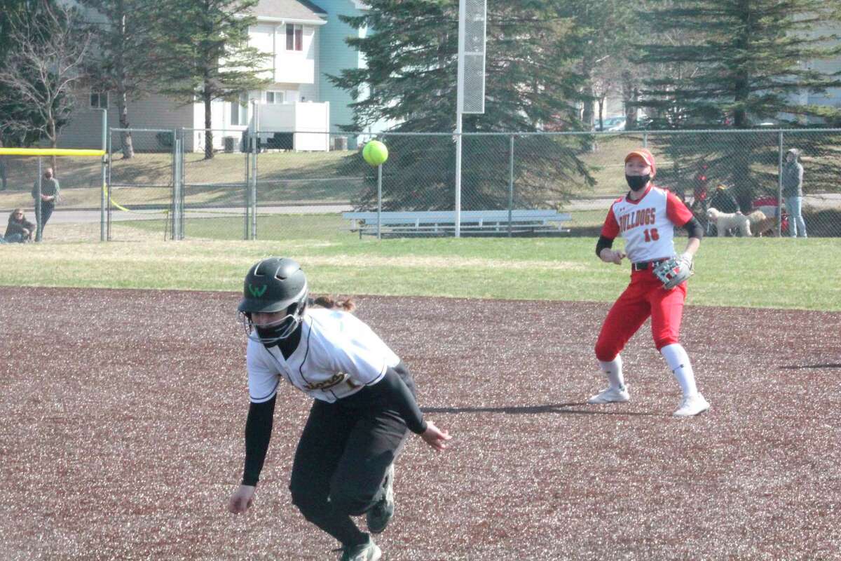 Ferris second baseman Kacey Bouche (16) watches her throw to first base to double up the Wayne State baserunner during the second game of Saturday's GLIAC twinbill. (Pioneer photo/John Raffel)