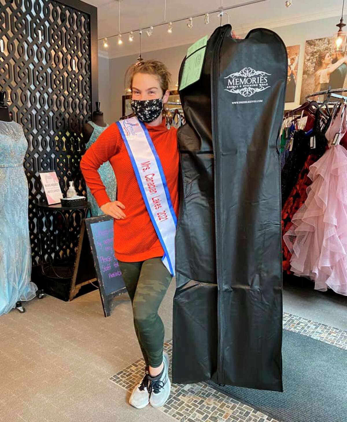 Jackie Blankenship, who will represent Mrs. Canadian Lakes in this year's Mrs. Michigan for America Pageant, is pictured at her favorite dress shop, Memories Bridal & Evening Wear, in Kalamazoo picking up her evening gown for the pageant. (Courtesy photo)