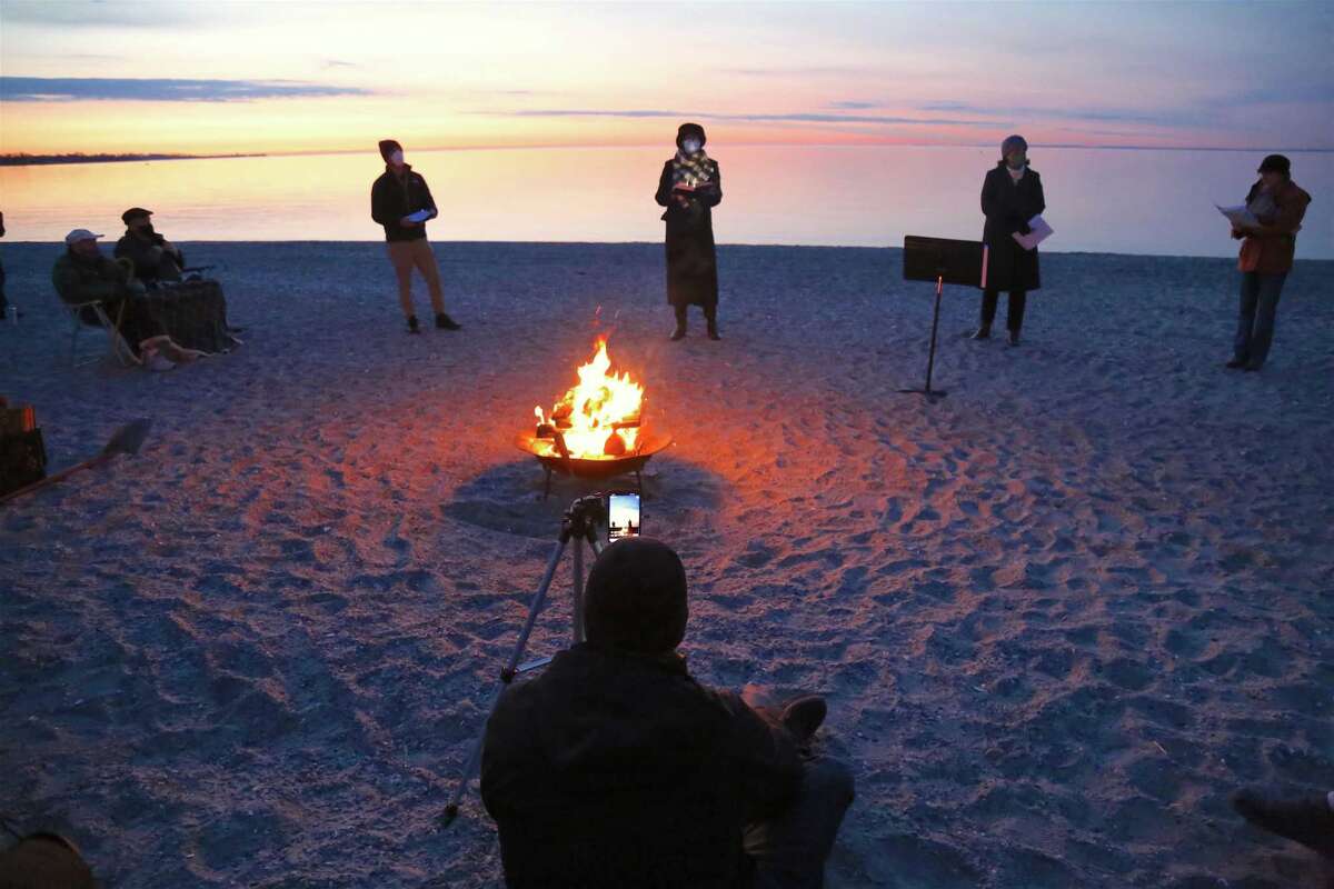 Craig Patton shares a live video feed for parishioners at home for the Easter Sunday Sunrise Service at Compo Beach on April 4, 2021.