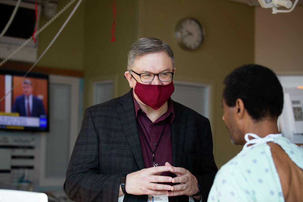 Chaplain Brian Gowan at Houston Methodist talks to Kiven Leday, 55, during a visit to Leday’s room at Houston Methodist, Thursday, April 1, 2021, in Houston. Leday is a patient waiting for a heart for a transplant.