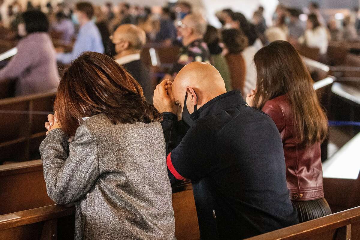 Attendees pray during an in-church Easter Mass celebration at Cathedral of Saint Mary of the Assumption in San Francisco, California Sunday, April 4, 2021. Following an April 9 Supreme Court ruling, prayer groups may soon be able to gather in person as well.
