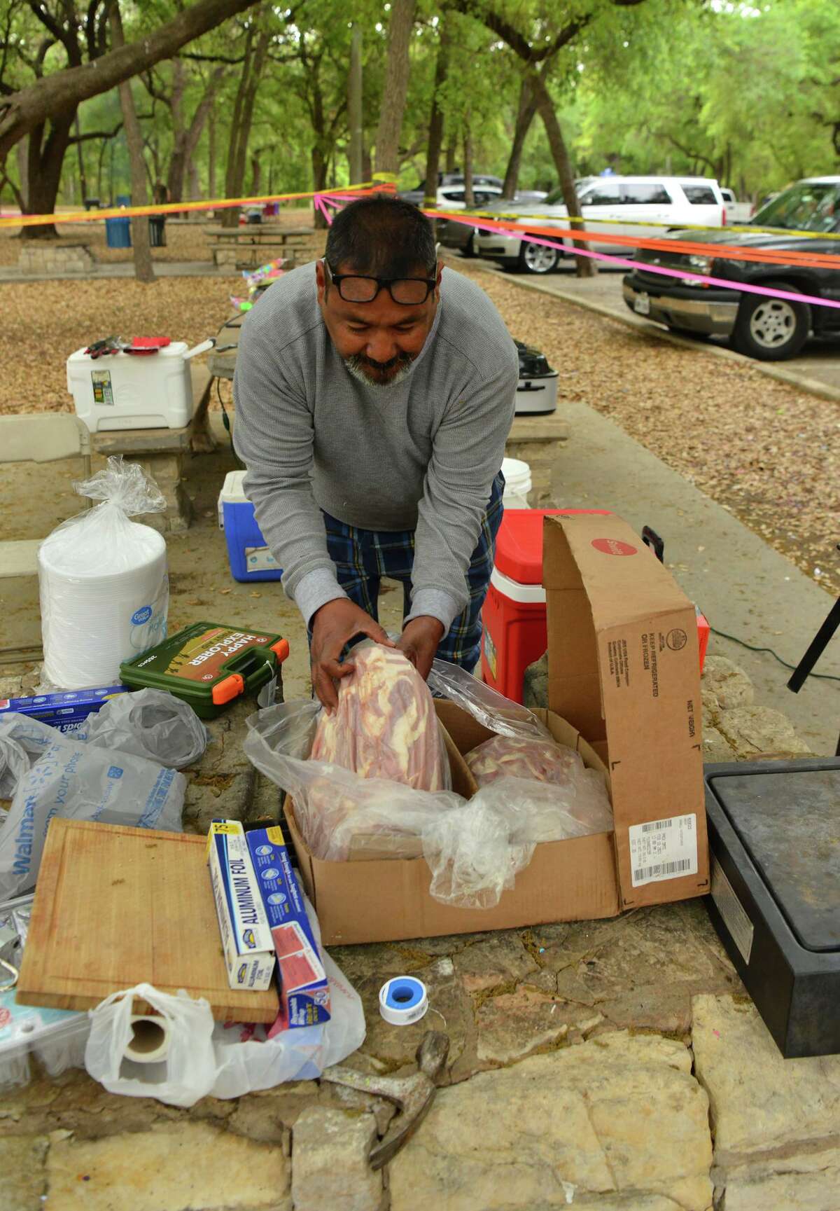 Samuel Rodriguez prepares his fripa's during an Easter Sunday barbeque in Brackenridge.