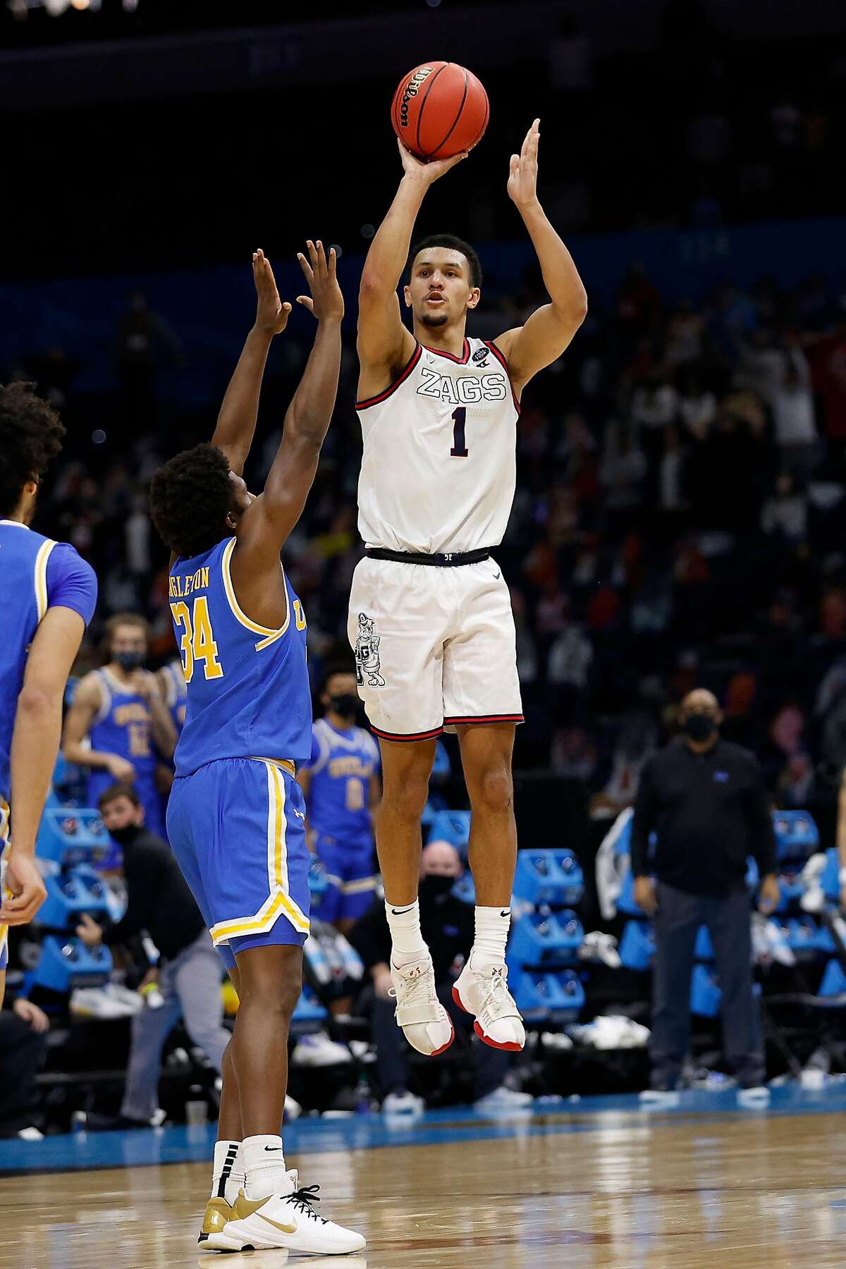 Gonzaga's Jalen Suggs (1) shoots the game-winning 3-point basket in overtime to defeat UCLA, 93-90, in the NCAA Tournament Final Four semifinals at Lucas Oil Stadium in Indianapolis on Saturday.