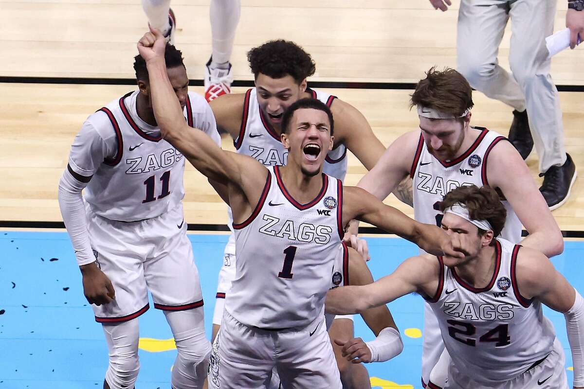 Jalen Suggs (1) leads the Gonzaga celebration after the Bulldogs’ overtime win over UCLA on Saturday. Gonzaga will try to complete a perfect season when it faces Baylor in the championship game at 6:15 p.m. Monday. (CBS)