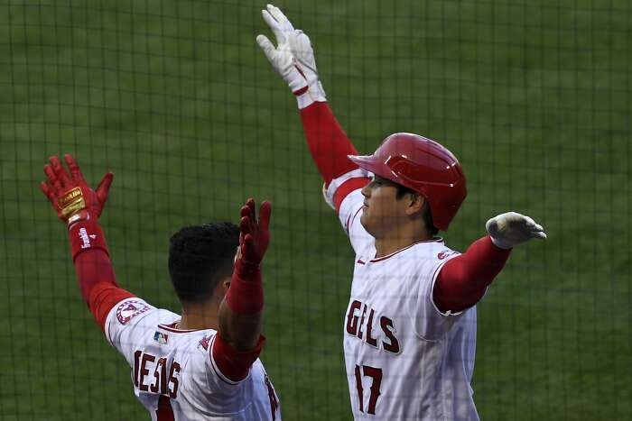 Texas Rangers fill stands with fans, who accept 'calculated risk