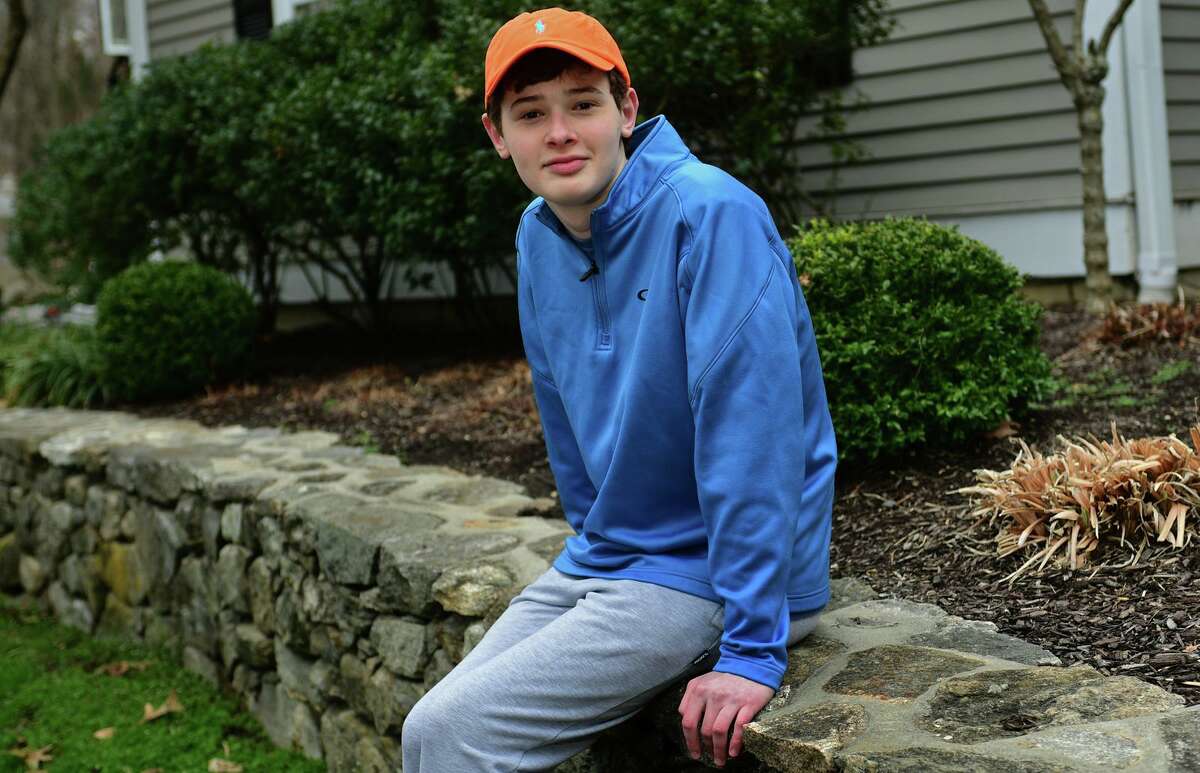 16-year-old, Luke Schwartz at his home Thursday, April 1, 2021, in Wilton, Conn. Schwartz has a rare type of thyroid cancer and a host of other health issues and had hoped that, due to his health issues, he'd get the COVID vaccine early. But, when Lamont went by an age classification, His mother took matters into her own hands and got Luke vaccinated in Vermont, where the family also owns a home.