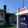 A real estate sign is seen in front of a house for sale in West Los Angeles on November 19, 2020. (Chris Delmas/AFP/Getty Images/TNS)