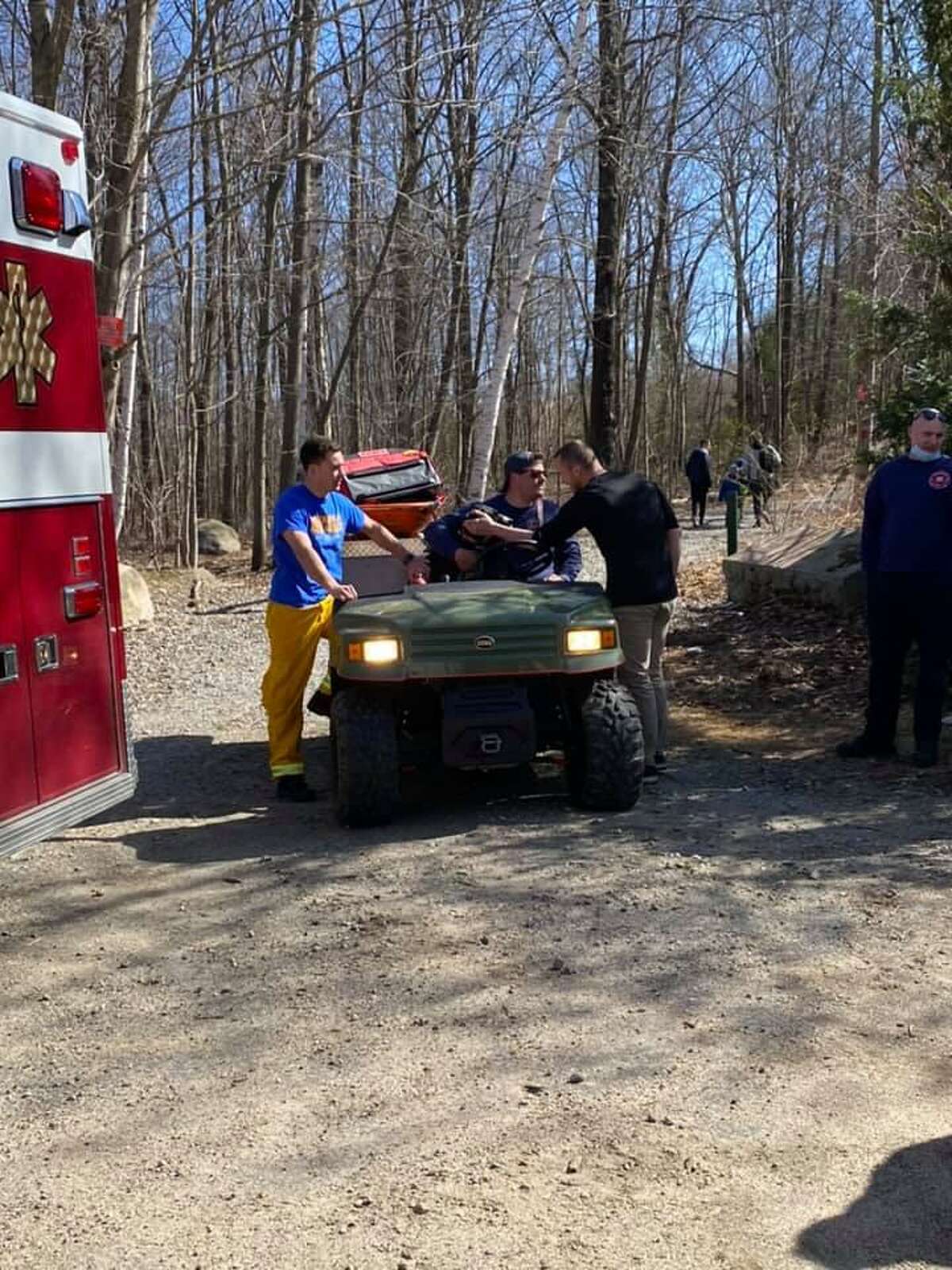Crews at the scene of the rescue a hiker in Naugatuck State Forest in Naugatuck, Conn., on Saturday, April 3, 2021.