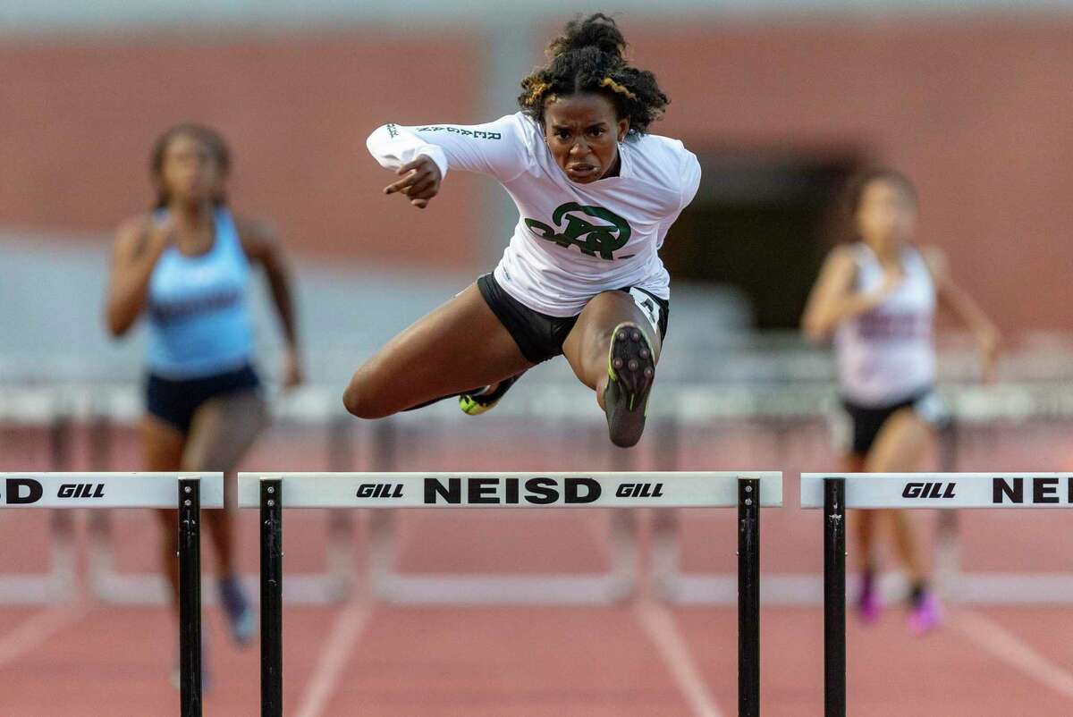 Reagan's Taylen Wise competes Thursday, April 1, 2021 in the 300-meter hurdles during the District 28-6A track and field championships at Heroes Stadium.