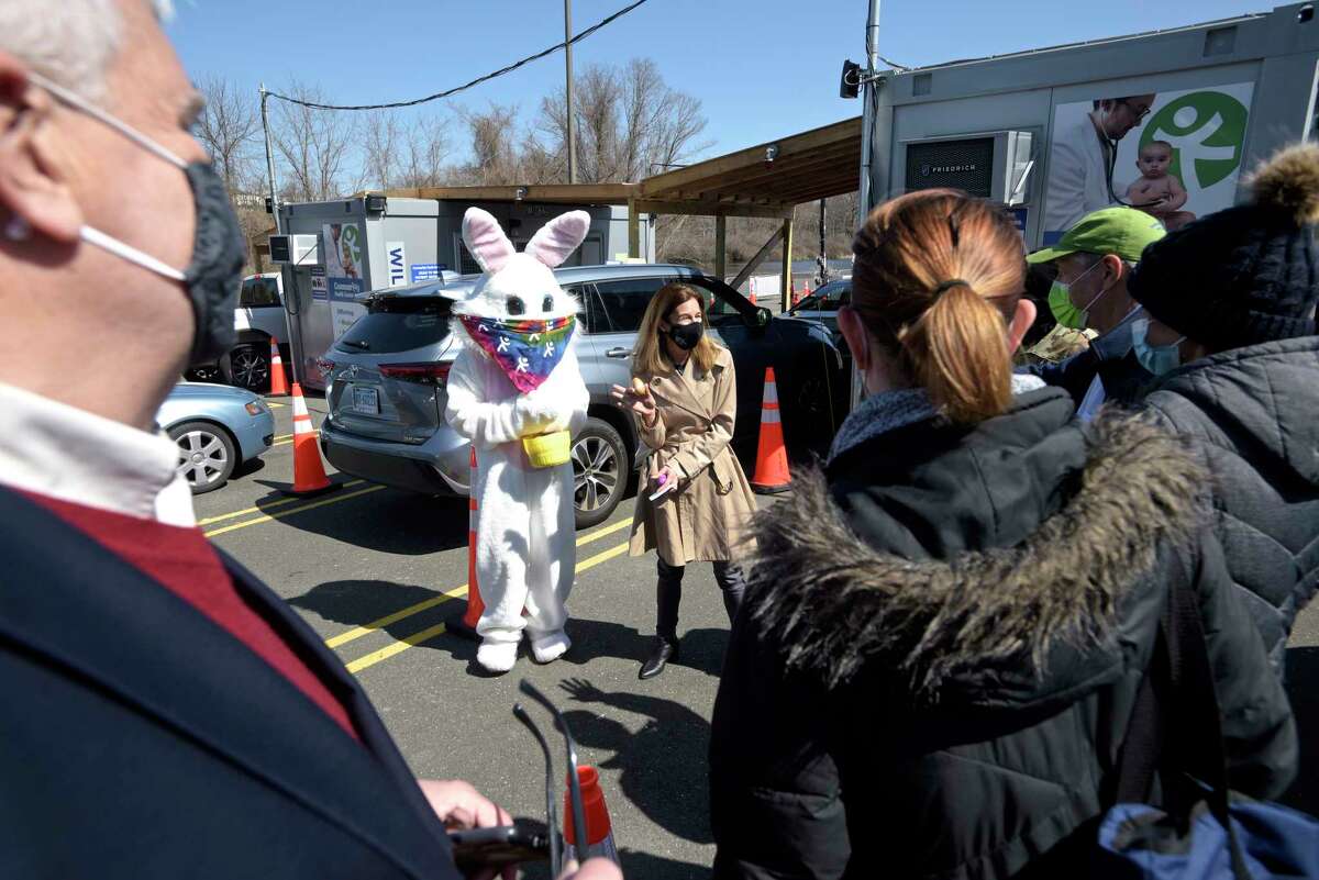 Lt. Governor Susan Bysiewicz shows off a White House Easter egg she received from the Easter Bunny after getting her second dose of COVID_19 vaccine at the Community Health Center's mass vaccination clinic at the Danbury Fair mall. Monday, April 5, 2021, in Danbury, Conn.