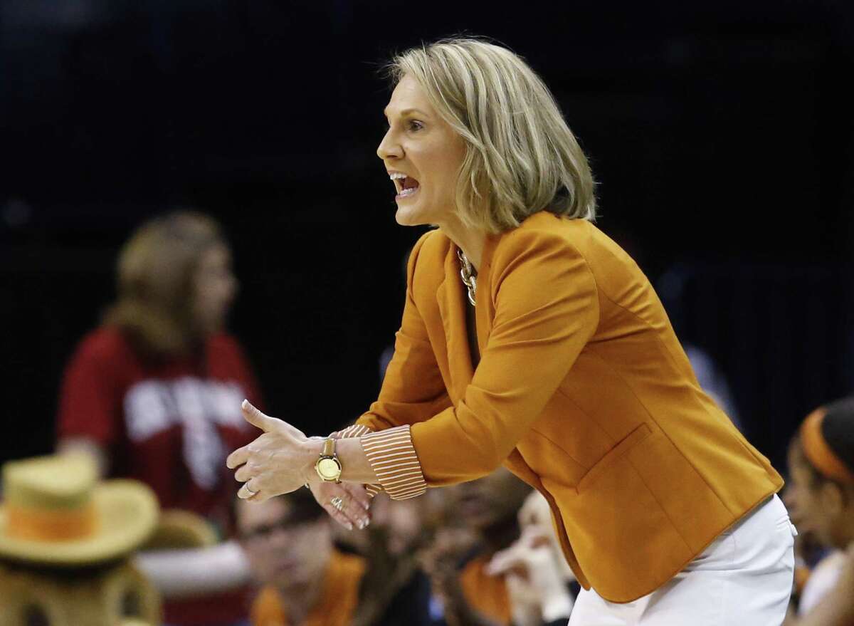 Texas head coach Karen Aston shouts to her team in the second quarter of an NCAA college basketball championship game against Baylor in the Big 12 women's tournament in Oklahoma City, Monday, March 7, 2016. (AP Photo/Sue Ogrocki)