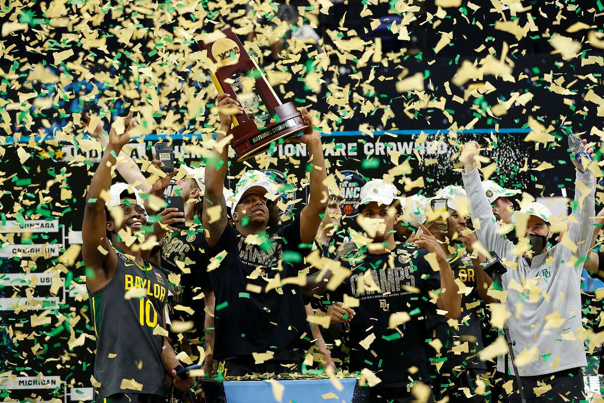 Mark Vital #11 of the Baylor Bears holds up the trophy after defeating the Gonzaga Bulldogs 86-70 in the National Championship game of the 2021 NCAA Men's Basketball Tournament at Lucas Oil Stadium on April 05, 2021 in Indianapolis, Indiana.